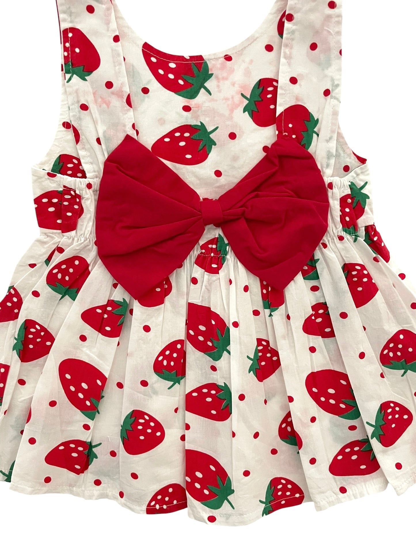Tunique blanche, fraises, noeud dans le dos