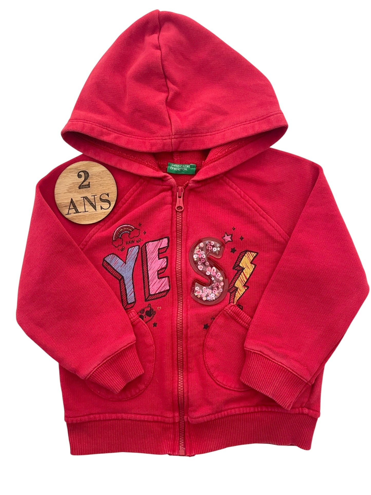 Gilet rouge, Benetton